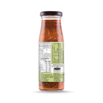 Bottle of Kanokwan Holy Basil Sauce from the grocery aisle, featuring the label with basil illustration and product details.