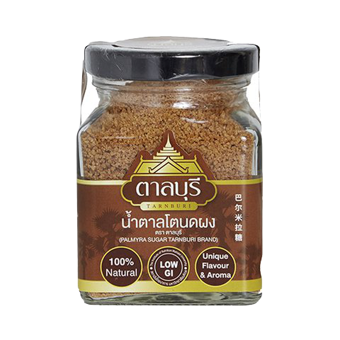 Tarnburi Palmyra Sugar in a clear container, showing golden brown, textured sugar crystals for baking and sweetening.