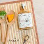 Bottle of Komori Salad Dressing Sesame, healthy grocery item with sesame flavor, shown in a clear glass bottle with a label.