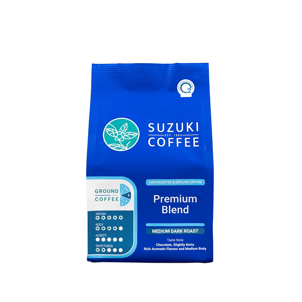 Suzuki Premium Blend drink in a clear glass, showing a vibrant, colorful beverage with ice cubes and lemon slices.