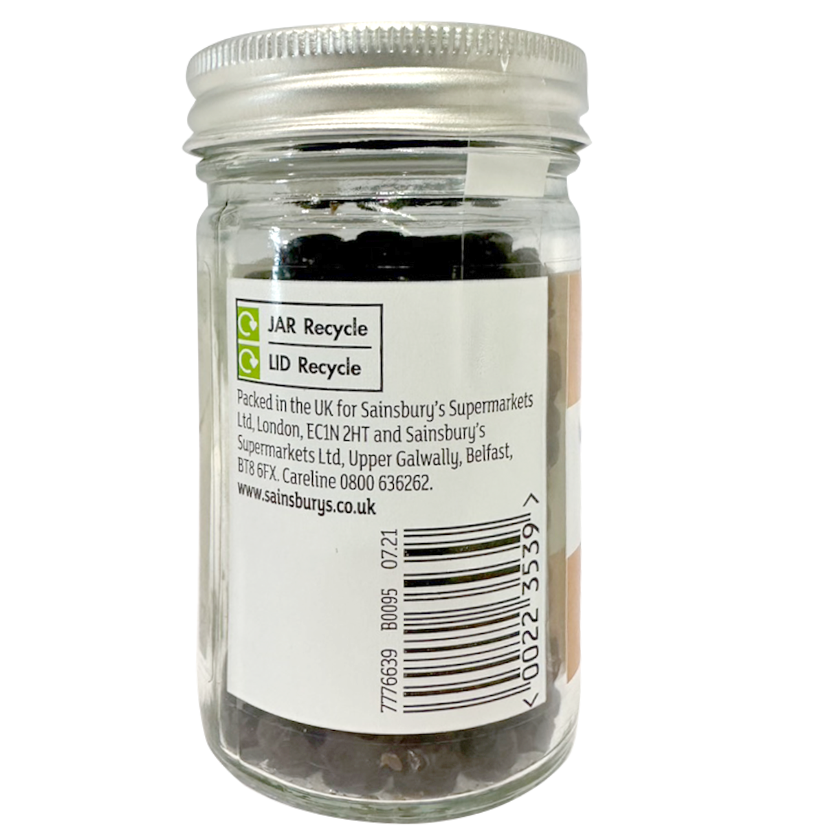 Sainsbury's juniper berries in a clear jar, showing small, dark blue berries used for cooking and flavoring.