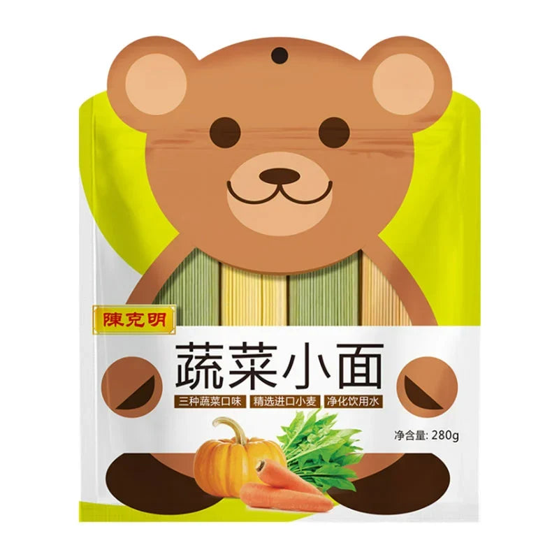 Dry vegetable noodles in a package labeled Chen Ke Ming, 280g, from the Chen Ke Ming brand, shown in a grocery store setting.