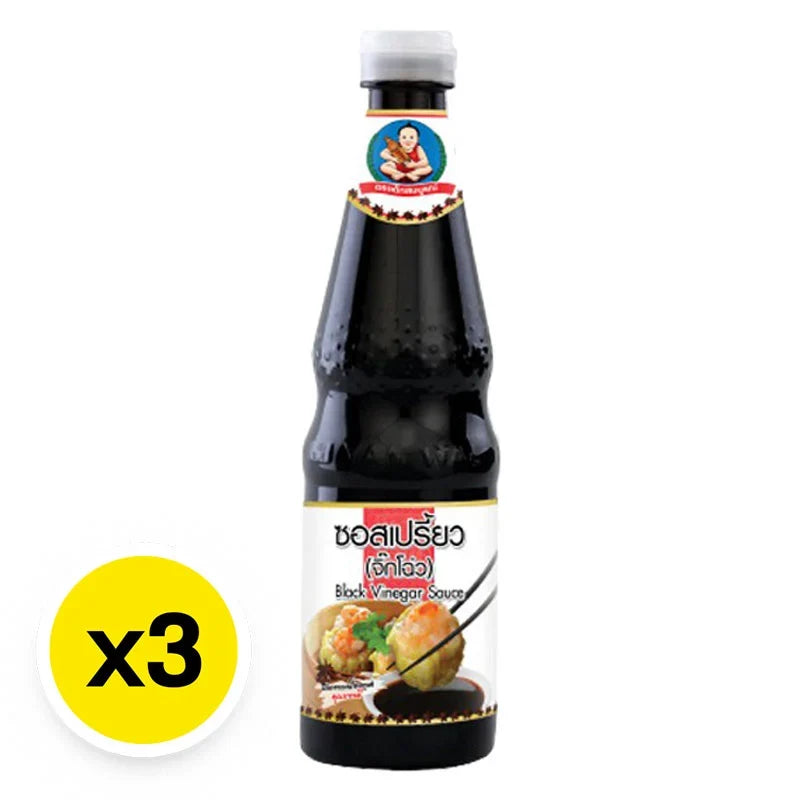Three bottles of DEK SOM Boon Black Vinegar, 600ml each, in clear plastic bottles with black caps, for dry grocery use.