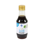 Tutiya Picante Garlic Sauce Jazzy bottle in dry grocery section, featuring vibrant label with garlic and spice illustrations.