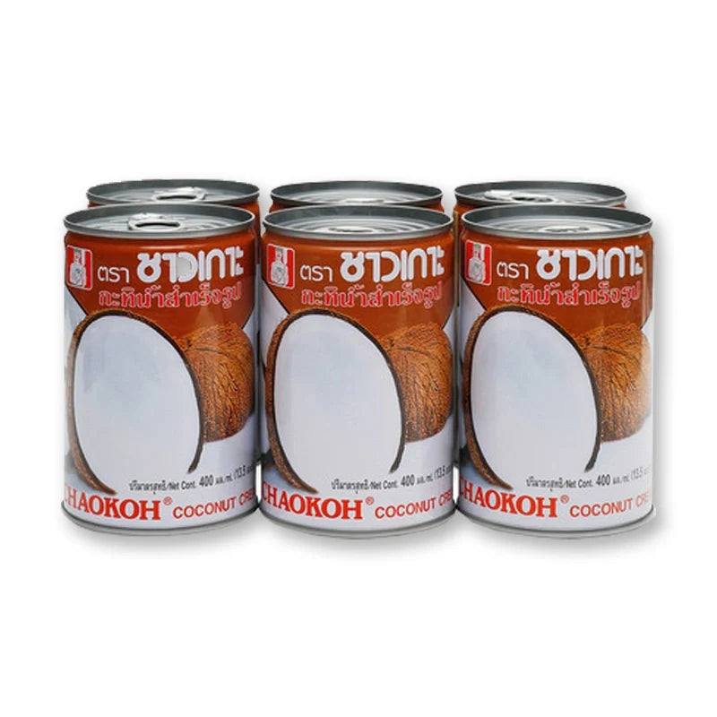 Chaokoh coconut milk in 400ml cans, stacked in a box, ready for cooking or baking in dry grocery section