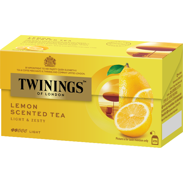 Twinings lemon scented tea drink in a clear glass mug, showcasing bright yellow tea with lemon slices and fresh lemon wedge.