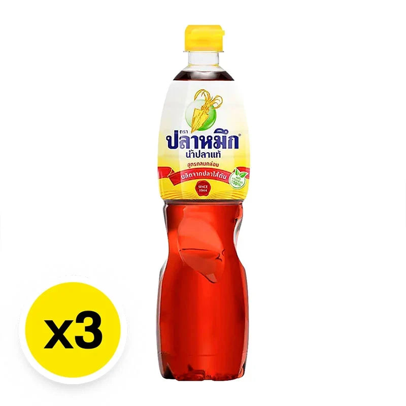 Squid Brand Fish Sauce Yellow 700ml bottles, dry grocery product, with golden-colored liquid in clear glass bottles.