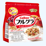 Frugra Fruit Granola original flavor in a bowl with fresh fruit and nuts, showcasing the crunchy cereal's texture and ingredients.