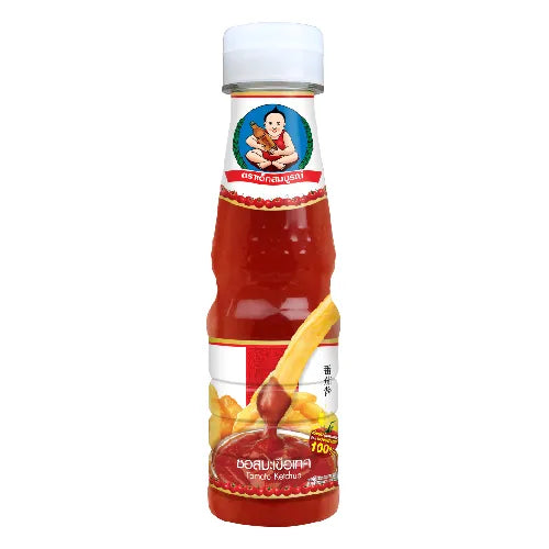 Deksomboon Tomato Sauce 165g jar, showcasing the label and product packaging for dry grocery use.