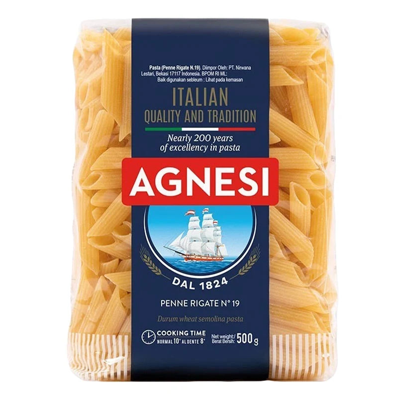 Dry Agnesi Penne Rigate No.19 pasta in a 500g package, showcasing the dry, ridged Italian pasta in a clear bag.