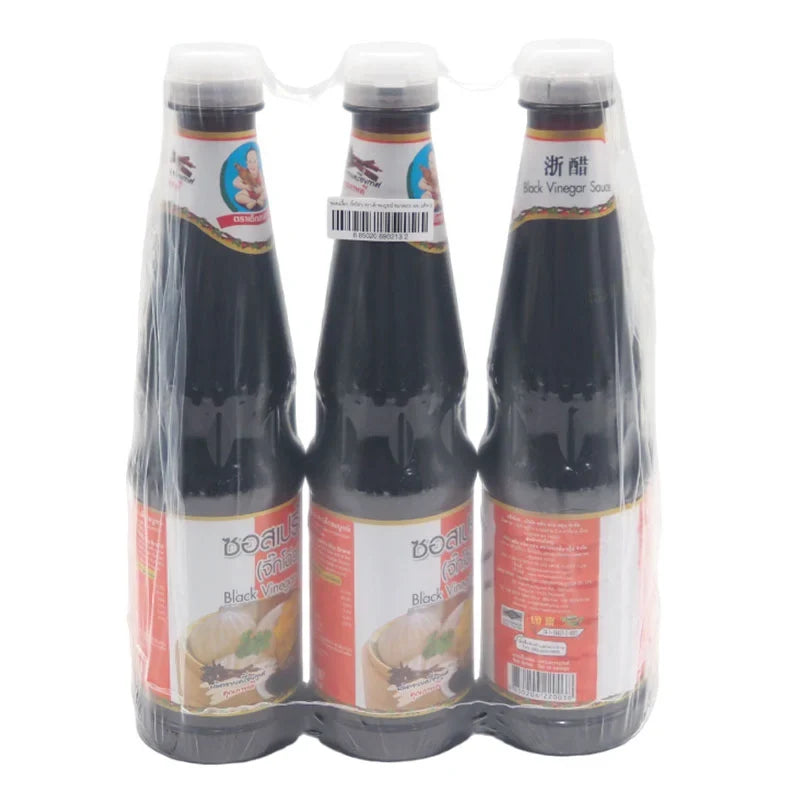 DEK SOM Boon Black Vinegar 600ml bottles, three-pack, in a clear plastic packaging, for use in cooking and seasoning.