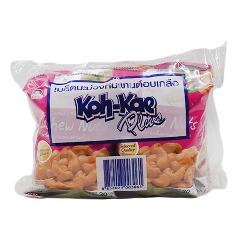 KOHKAE salted cashew nuts in 30g packs, displayed in a bowl with some cashews spilled around, on a wooden surface.
