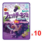 Bourbon Fettuccine Gummy candies with grape juice flavor, colorful gummy strips on a white background, dry grocery snack.