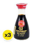 Kikkoman soy sauce bottles, 150ml each, displayed in a pack of three, for use in cooking and seasoning.