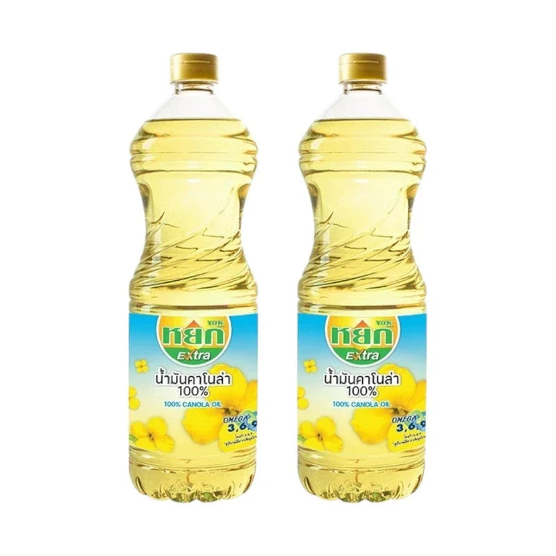 Yok Extra 100% Canola Oil in two 1-liter bottles, ideal for cooking and baking in dry grocery aisle