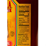 Bottle of Cholula Original Hot Sauce with wooden cap and label, placed on a kitchen counter, ready for use in cooking or as a condiment.
