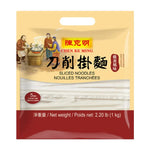 Dry grocery Chen KE Ming sliced egg noodles in 1kg package, showing neatly stacked yellow egg noodle slices in a clear bag.