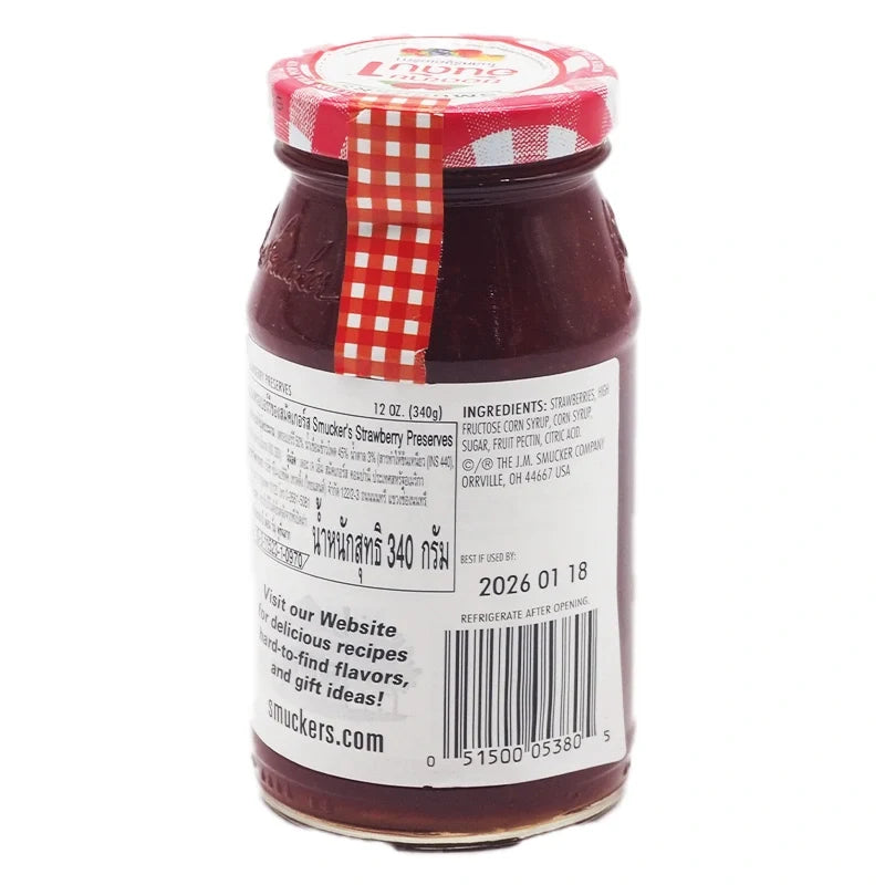 Jar of Smuckers Strawberry Jam in 340g glass jar, with fresh strawberries on the label, ideal for spreading on bread.