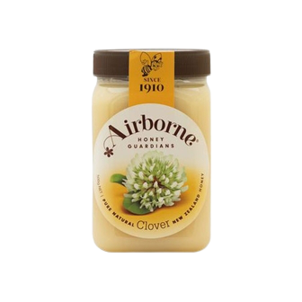 Airborne Clover Honey Cream in a jar, showcasing smooth honey spread with a golden color and creamy texture.