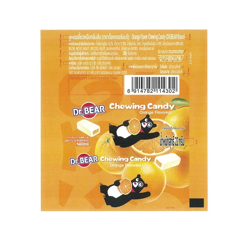 DR.BEAR soft fruity orange candies in 22g packs, shown in a colorful display of snack confectionery.