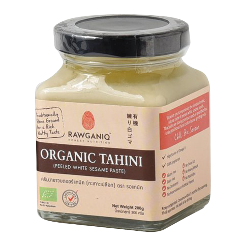 Rawganiq Organic White Tahini Peeled in a jar, showcasing smooth, creamy white sesame paste for healthy cooking and snacks.