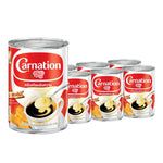 Carnation sweetened condensed milk 505g cans, six-pack, in a cardboard box, showing cans with the Carnation label and metal lids.