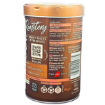 Nescafe Gold Blend Roastery Light Roast Coffee drink in a glass with frothy top and coffee beans in the background.