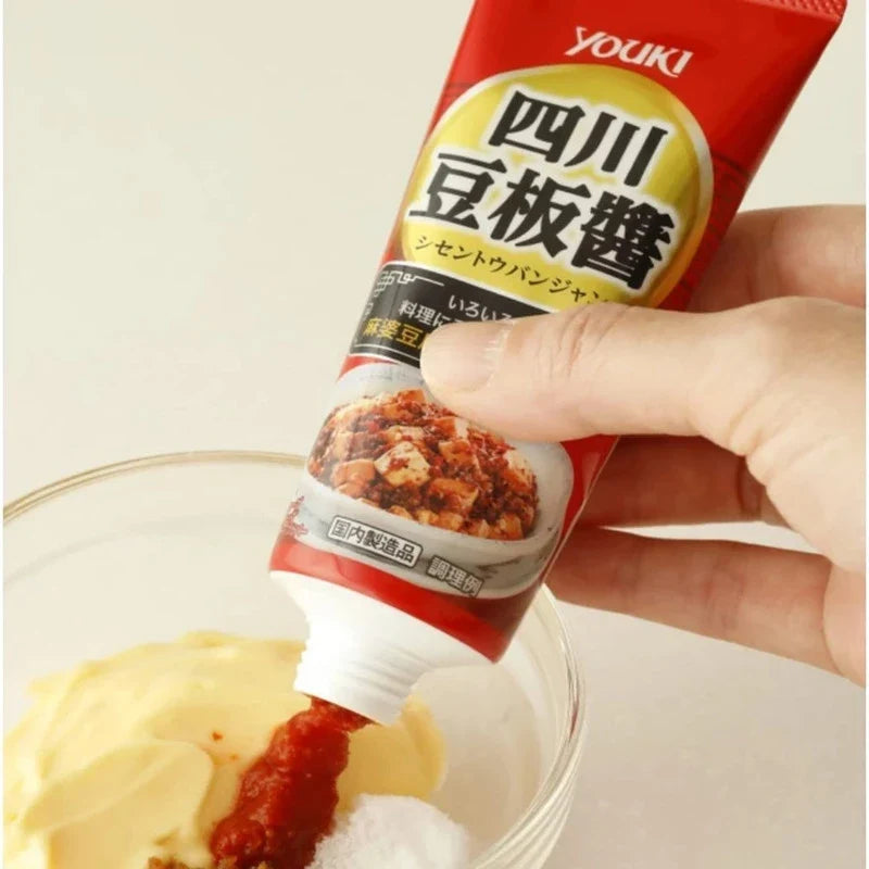 Youki Shisen Tobanjan Sichuan Chili Miso Doubanjiang sauce in a jar, featuring red chili paste with spicy and savory appearance.