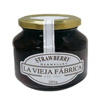 Jar of LA Vieja Fabrica Strawberry Mermelada in 350g glass container, with fresh strawberries and jam spread visible inside.