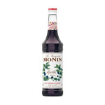 Monin Butterfly Pea Syrup 700ml bottle, a colorful dry grocery product with a vibrant blue liquid in a clear plastic bottle.