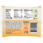 Daiya vegan sliced cheddar cheese on a cutting board, showcasing its healthy plant-based cheese slices.