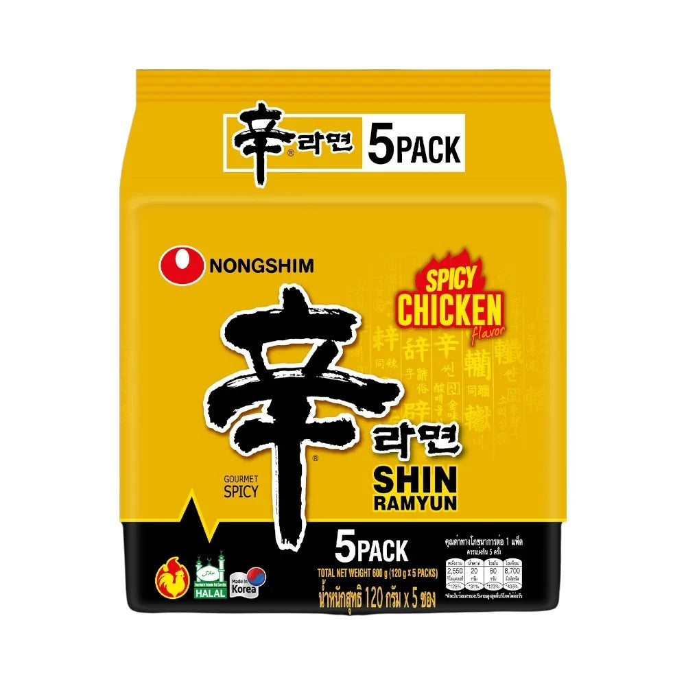NONGSHIM Shin Ramyun spicy chicken instant noodle package in dry grocery section, featuring bold red and yellow branding.