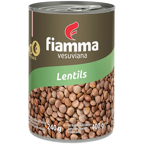 Fiamma Vesuviana lentils in a clear bowl, showcasing their small, round, light brown appearance on a white background.