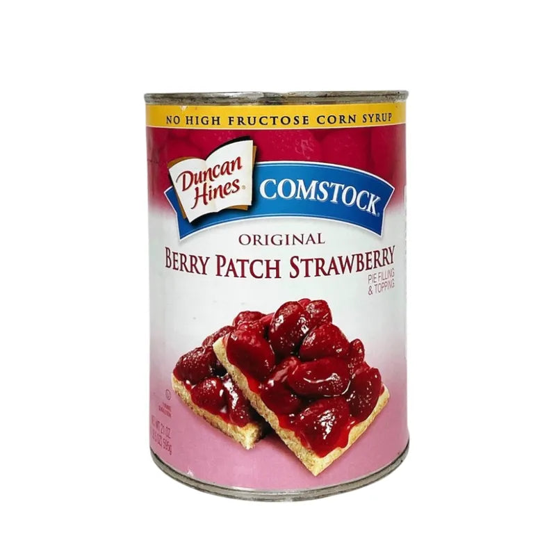 Wilderness Strawberry Pie Filling 595g jar with fresh strawberries and filling visible in a clear glass jar.