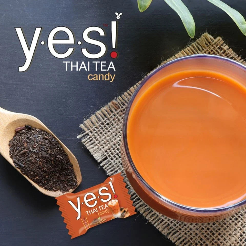 YES Thai Tea Flavored Candy, 12 packs of confectionery snacks with vibrant packaging and Thai tea branding.