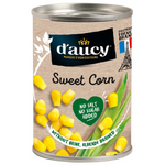 Cans of Daucy Super Sweet Corn in a grocery store shelf, showing the bright yellow corn inside the labeled can.