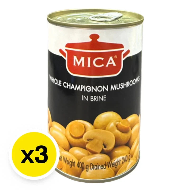 Cans of MICA Whole Champignon Mushrooms in brine, 400g each, stacked in a row for dry grocery use.