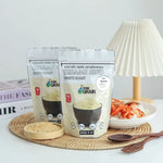 Pure Grain 100% roasted white sesame seeds in an 80g package, suitable for dry grocery use and cooking.
