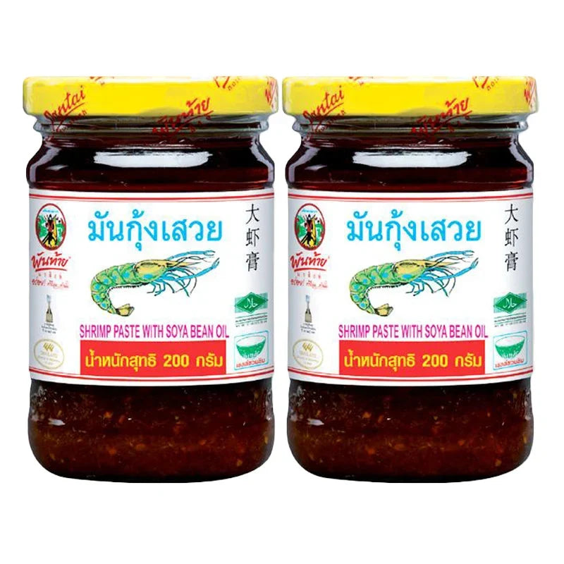 Pantainorasingh shrimp paste with soy bean oil, 200g pack, in a clear container, used for cooking and flavoring Asian dishes.