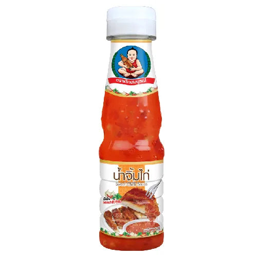 Deksomboon Sweet Chili Sauce 180g bottle from dry grocery aisle, with bright label and red chili sauce visible.