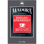 Madura English Breakfast tea bags in a box, ready for brewing, with classic packaging and tea leaves visible.