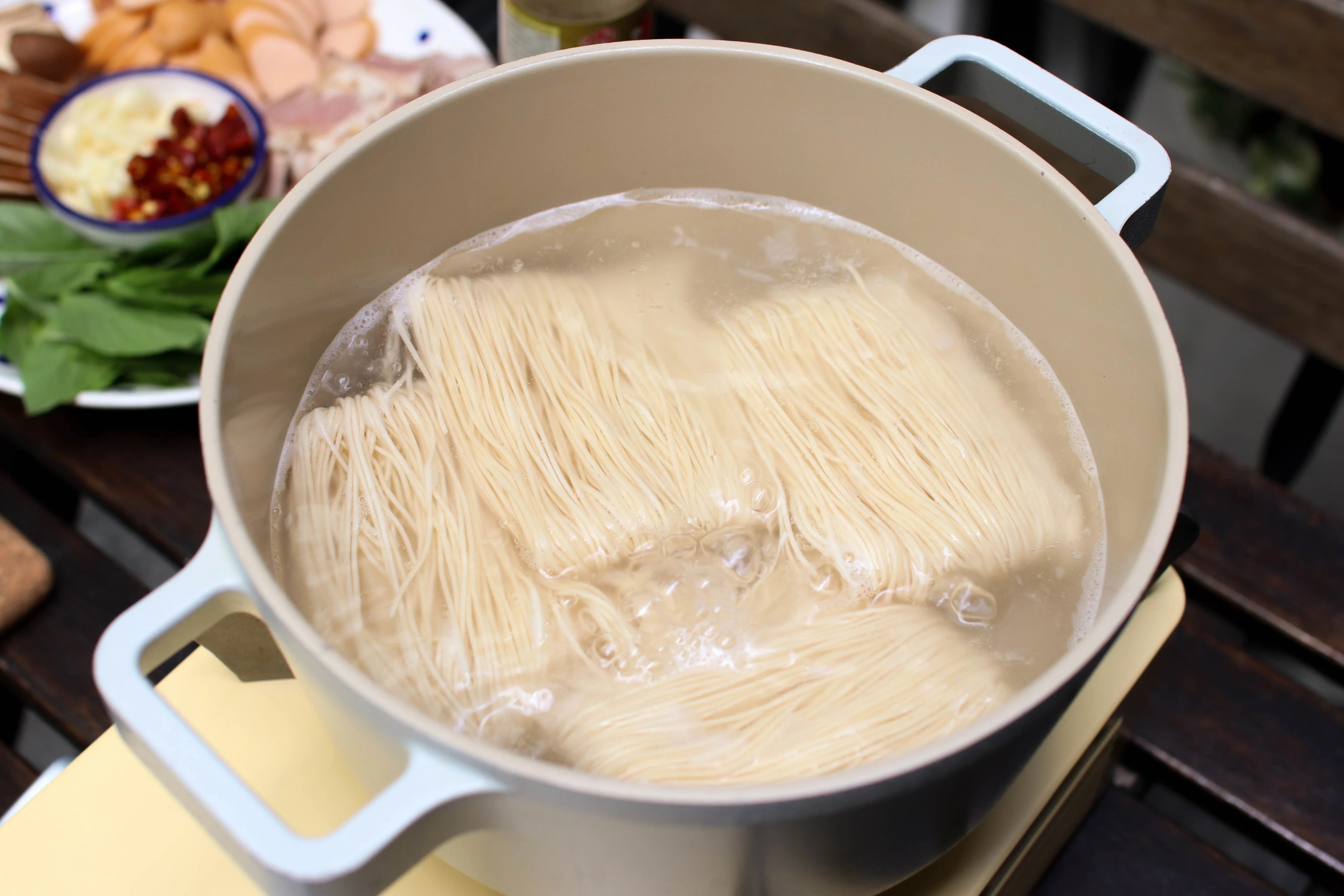 Dried Hong Kong style noodles in a 500g package from Rabbit Brand, suitable for Asian cuisine recipes.