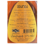 Jar of Ong Dhong Wild Flower Honey with a golden amber color, showcasing fresh wildflower honey from Ong Dhong brand.