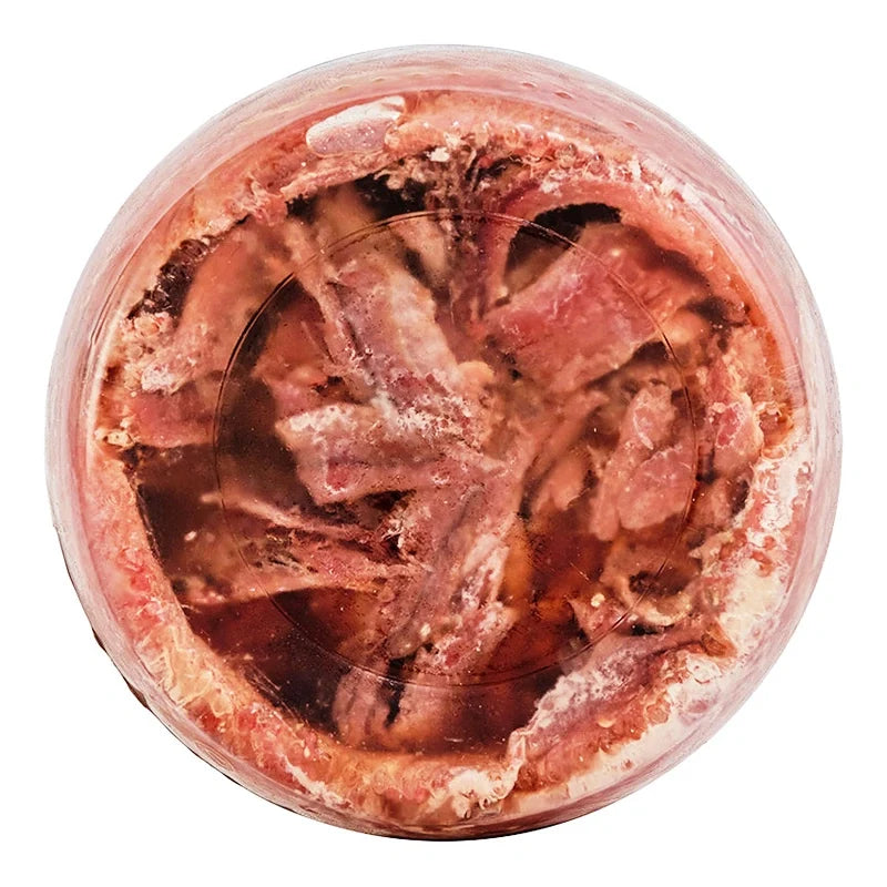 Canned Robo Anchovy in oil, 680g jar, showing anchovies submerged in oil in a clear glass container.