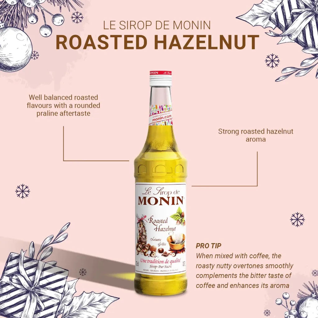 Bottle of MONIN Hazelnut Syrup in 700ml size, ideal for coffee and dessert flavoring, with a clear label and dark brown liquid inside.