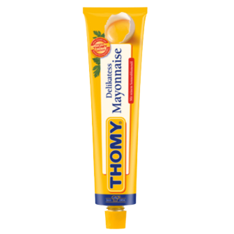 Thomy Delikatess Mayonnaise jar with label, creamy texture visible, on a grocery shelf.