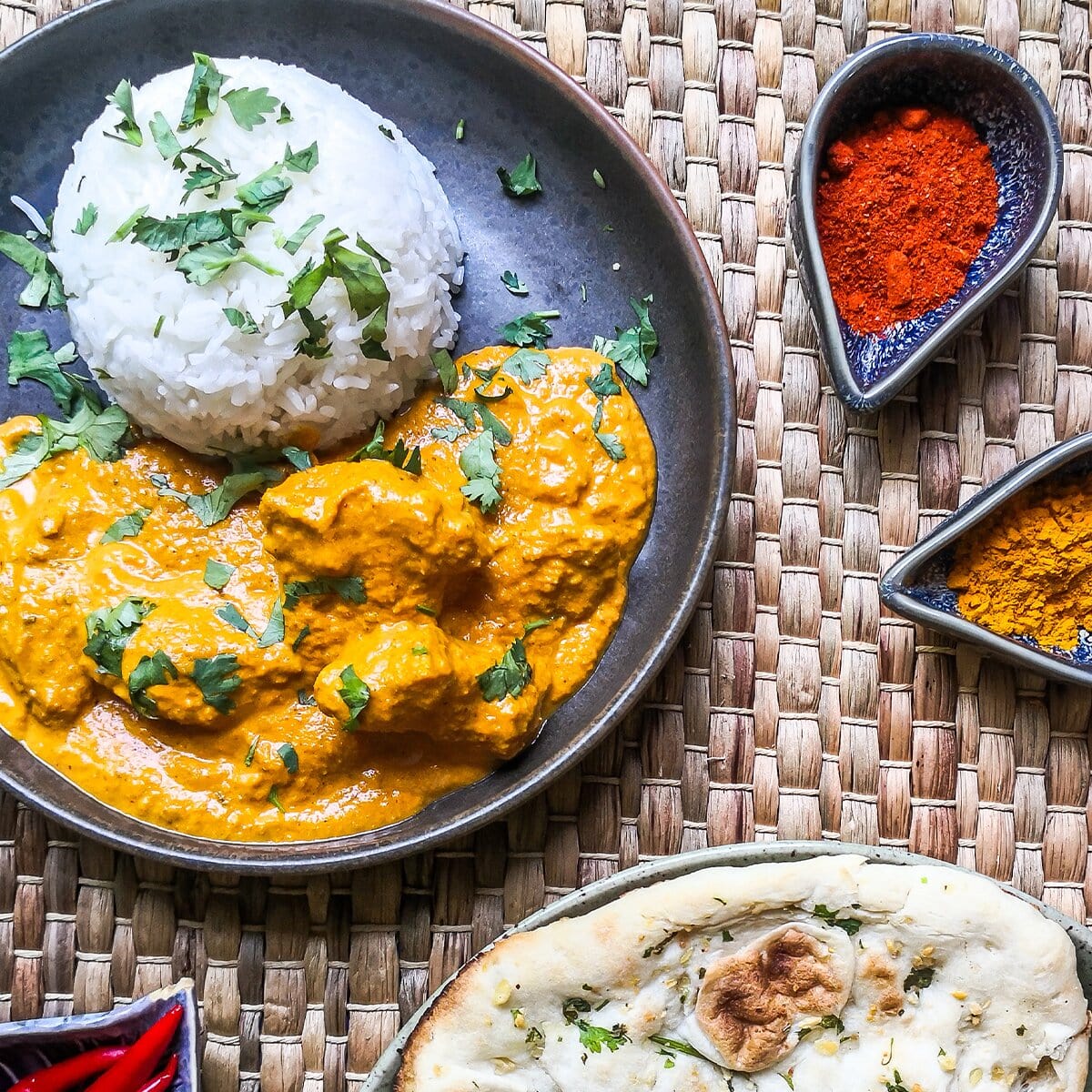 Vegan Ready Chick'N Tikka Masala in a bowl, showcasing plant-based chick'n pieces in rich, spicy tikka sauce on a white background.