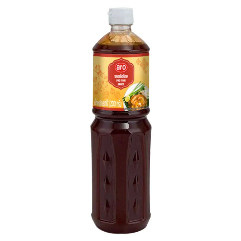 Aro Pad Thai Sauce 1.2kg bottle, dry grocery product, close-up of the jar showing the label and sauce inside.