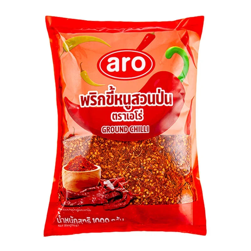 A 1kg pack of ARO Ground Chilli in a clear plastic bag, showing vibrant red dried ground chili powder for cooking.