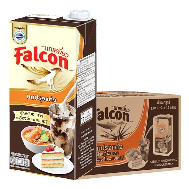 Falcon evaporated milk 1L cartons, 12-pack, dry grocery product with metal lids, displayed in a grocery store setting.